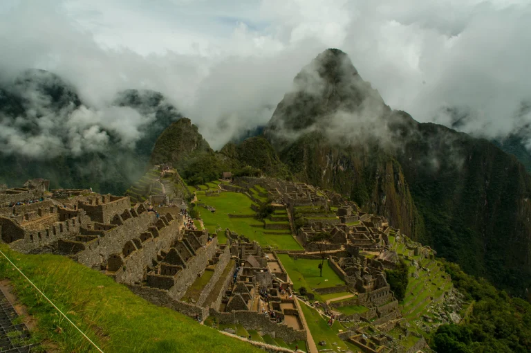 Machu Picchu sunrise Peru with mountains and ancient ruins