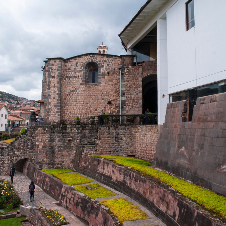 Inca stone walls and colonial architecture at Qorikancha in Cusco.