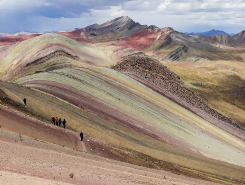Easy hike at Palcoyo rainbow mountain with multiple colorful hills in Cusco Peru