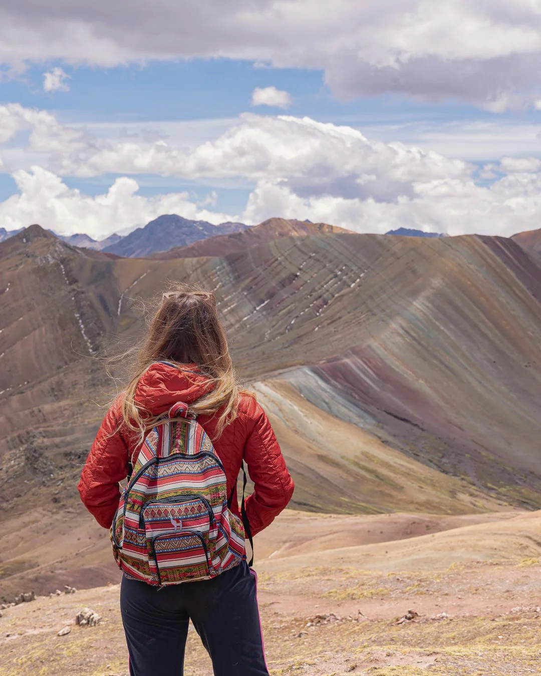 Palcoyo rainbow mountain tour showing colorful peaks and peaceful landscapes Cusco Peru