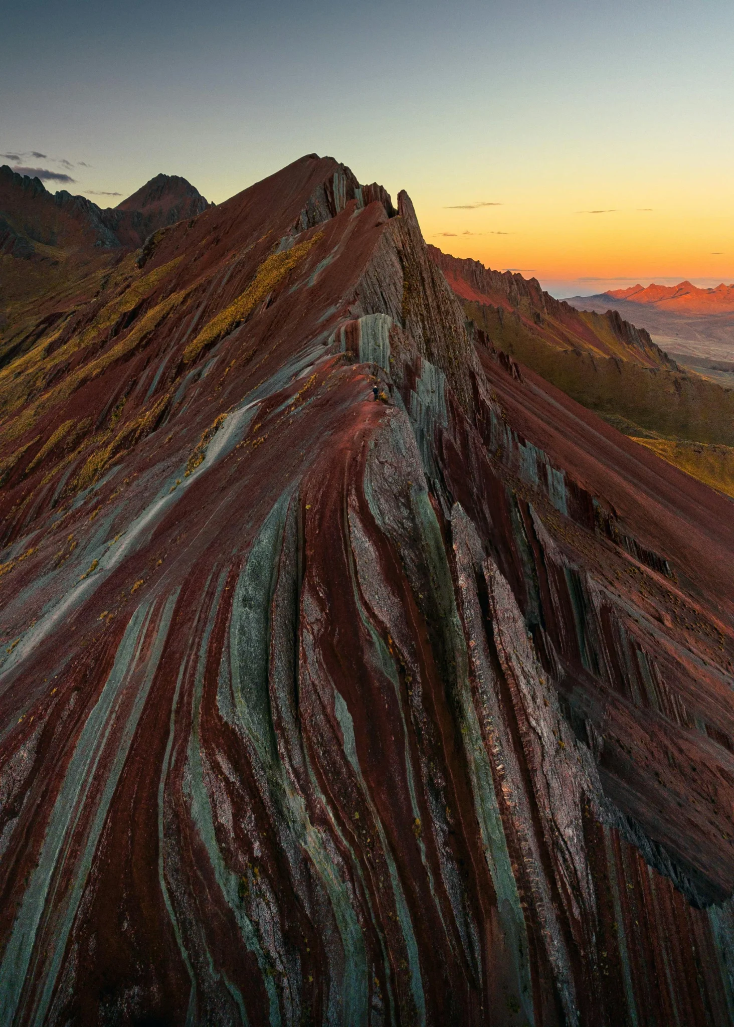 Scenic view of Pallay Punchu rainbow peaks with dramatic Andes background