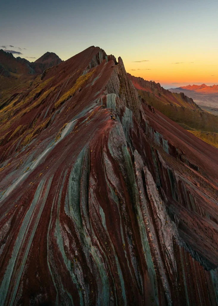 Scenic view of Pallay Punchu rainbow peaks with dramatic Andes background