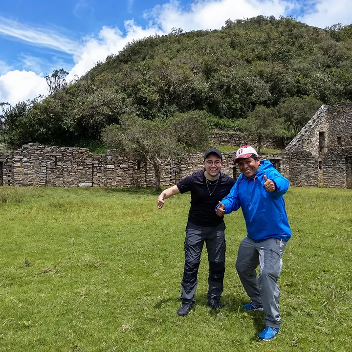 Two friends celebrating among the ruins of Choquequirao.