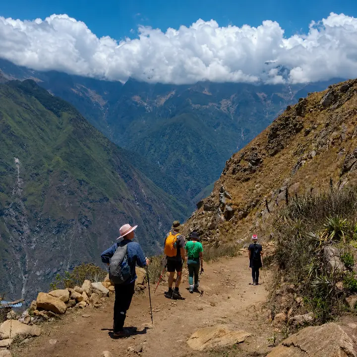 Hikers descending a rugged trail above the Apurimac Canyon.
