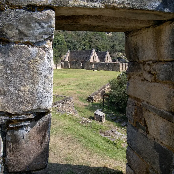 Stone window overlooking the main buildings of Choquequirao.