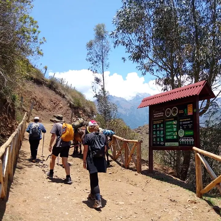 Trekkers passing the information point on the Choquequirao trail.