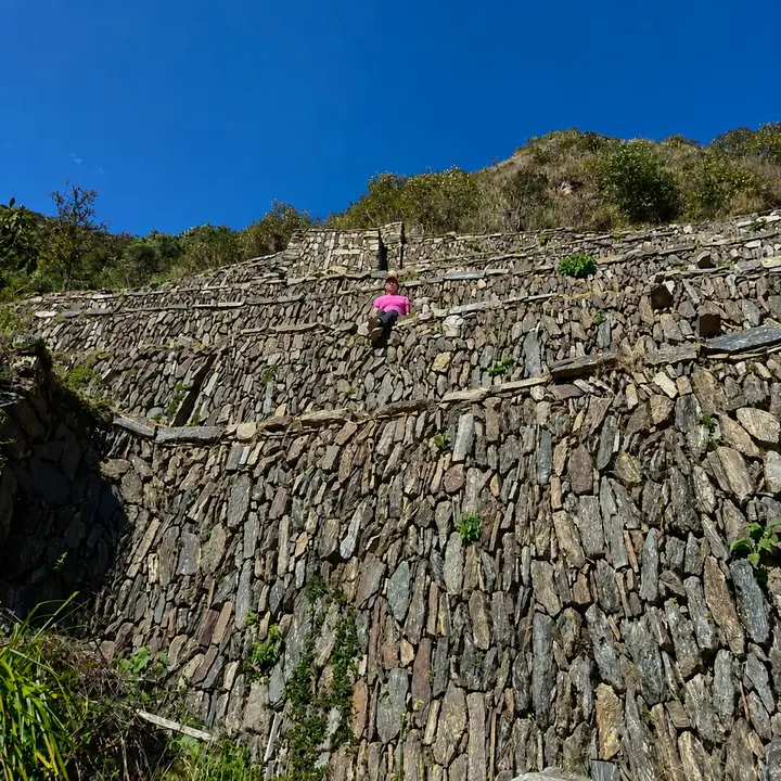 High stone terraces built into the steep Choquequirao mountainside.
