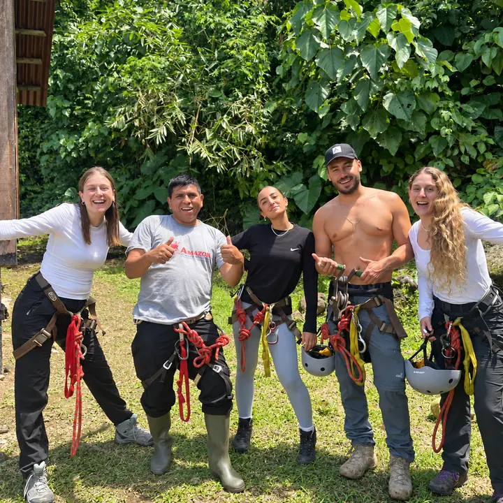 Travelers wearing adventure gear in the Manu rainforest.