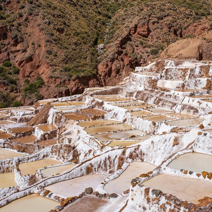 Mineral-coated walls surrounding salt ponds at Maras.