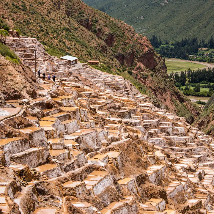 Terraced salt ponds descending through the Maras valley.
