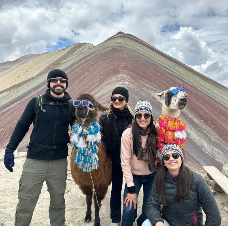 Llamas at Rainbow Mountain Cusco Peru with colorful mountain background