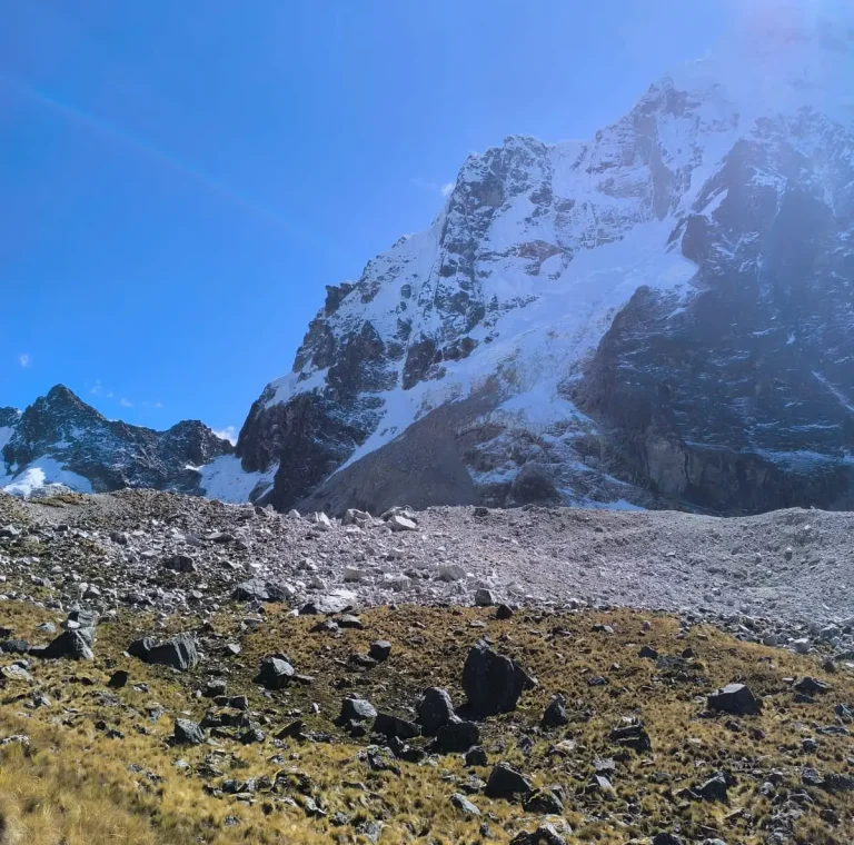 Close view of the snow-covered Salkantay Mountain beneath a clear blue sky on the Salkantay Trek.